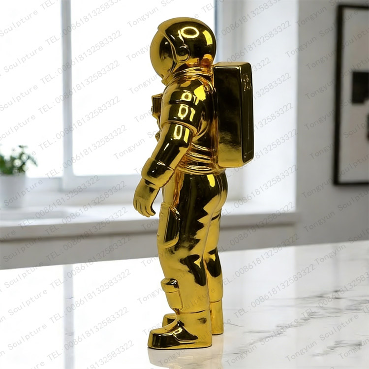 Gold Metal Astronaut Figure Statue Modern Space Decor.jpg