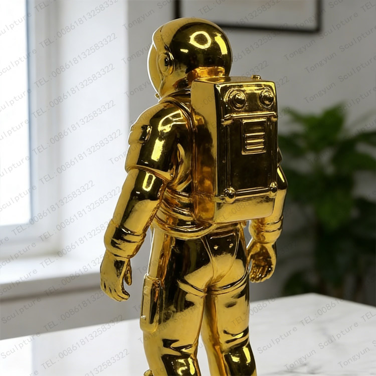 Gold Metal Astronaut Figure Statue Modern Space Decor.jpg